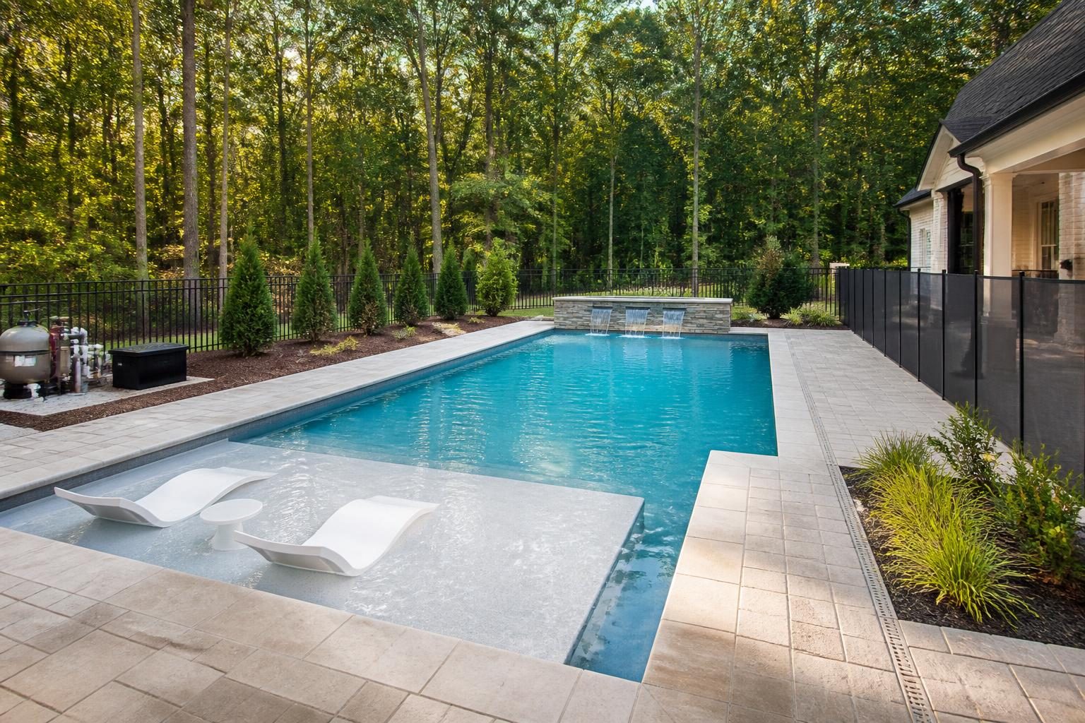 Pool shape and depth planning shown in a North Carolina residential backyard with lounging and swimming areas