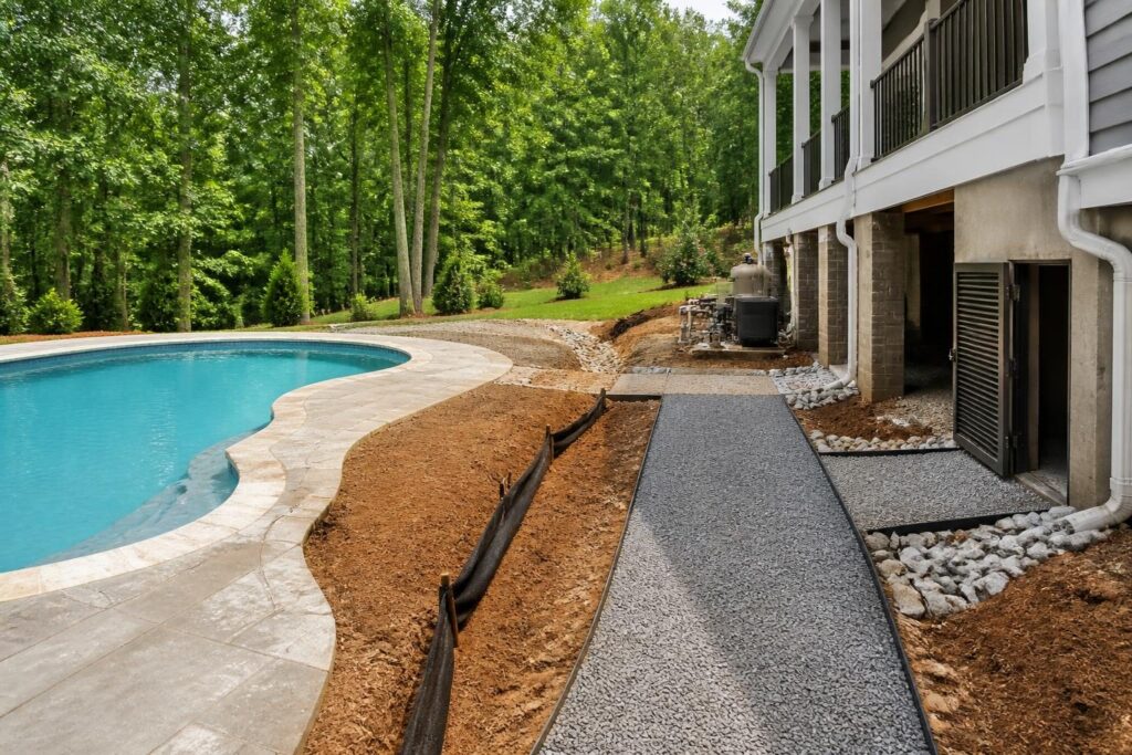 Pool construction near crawl space moisture planning with drainage and foundation access in a North Carolina backyard
